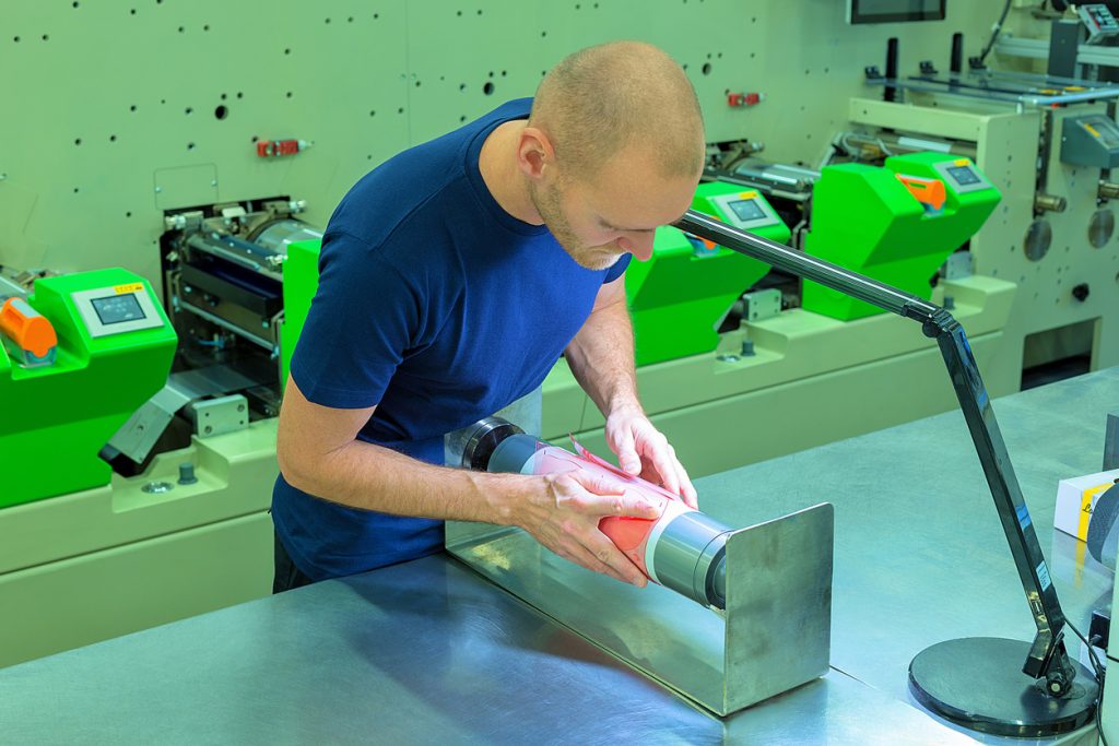 An image of a person performing flexographic printing
